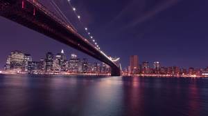 海を渡る橋の夜景のPPT背景画像
