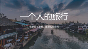A travel PPT template for a person with a Jiangnan water town background