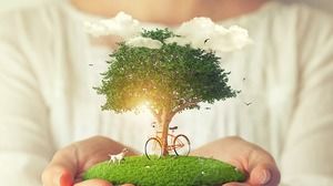Green tree puppy bicycle environmental theme PPT background picture