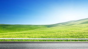 Image d'arrière-plan PPT de ciel bleu et d'herbe blanche à côté de l'autoroute