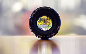 Gambar latar belakang PPT lensa SLR dengan latar belakang yang elegan dan kabur
