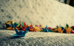 Three multicolored paper cranes PPT background pictures